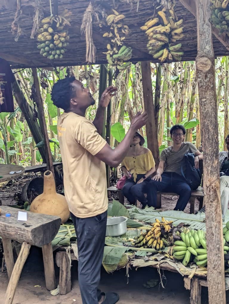 Tourists in Bigodi Community Observing the making of local Beer.